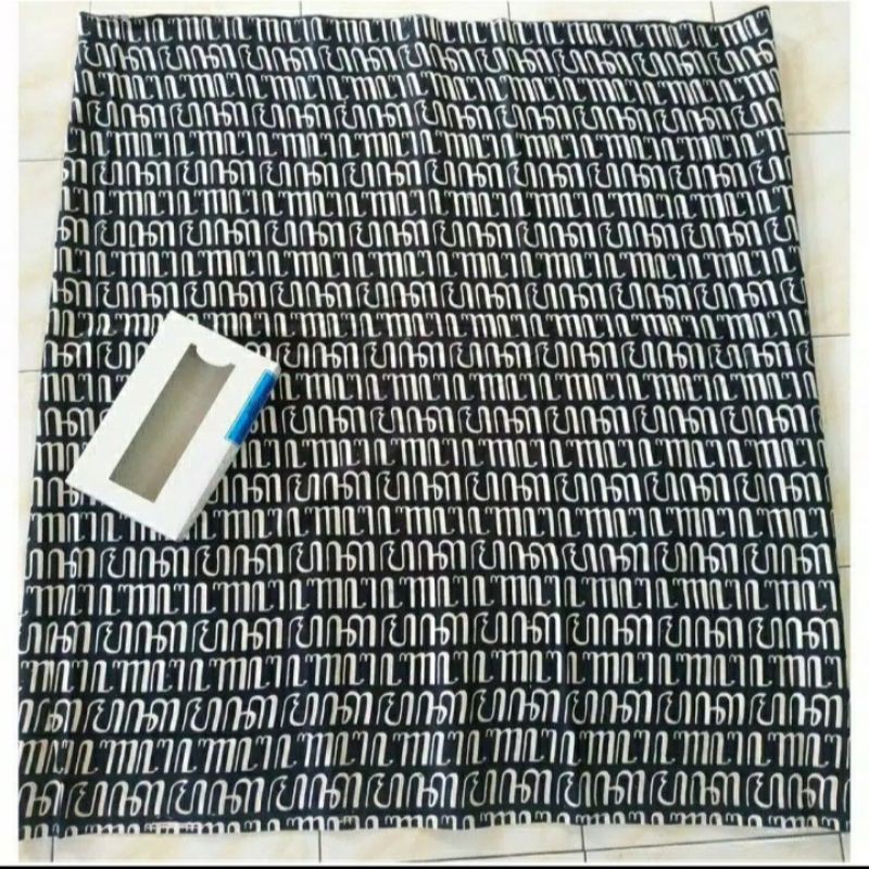 Sarung batik motif aksara jawa putih