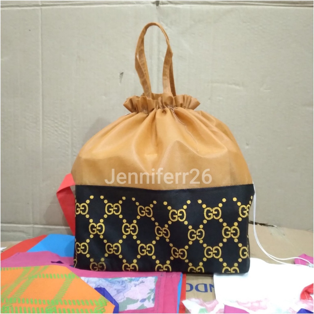 

Tas hajatan spunbond serut motif coklat 22 lusinan
