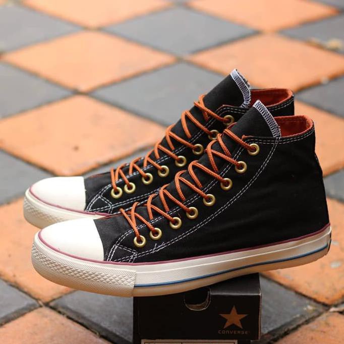 tan and black converse