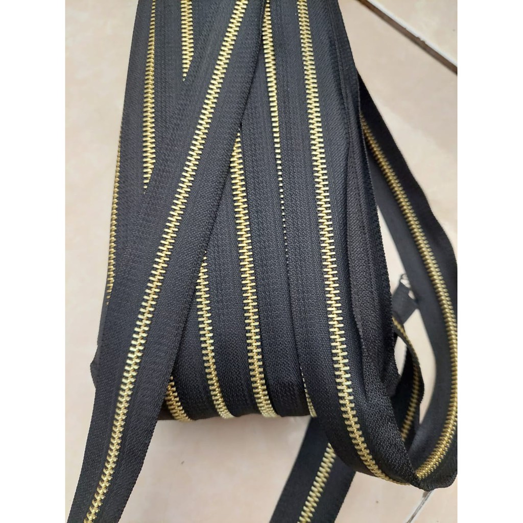 DAUN RESLETING GIGI BESI NO 5 METERAN, REL DAUN GIGI BESI, ZIPPER GIGI BESI METERAN, AKSESORIS TAS