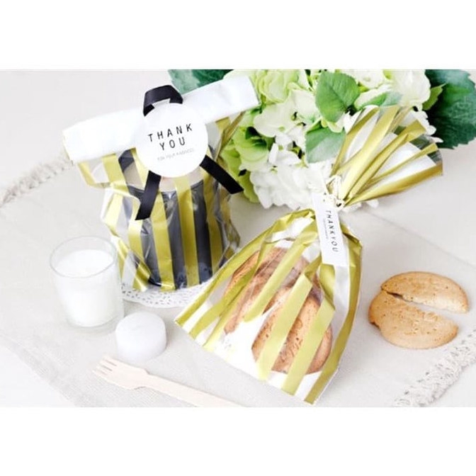 

Plastik Bungkus Kue Permen Roti 14 X 25 Cm Bening Kuning Garis
