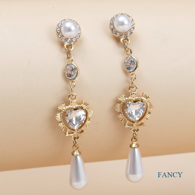 Anting Menjuntai Bentuk Hati Aksen Kristal Mutiara Bahan Alloy Gaya Korea Untuk Wanita