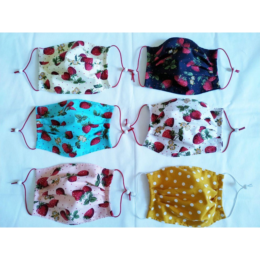 Masker kain motif random 2 lapis/tagan  pertama