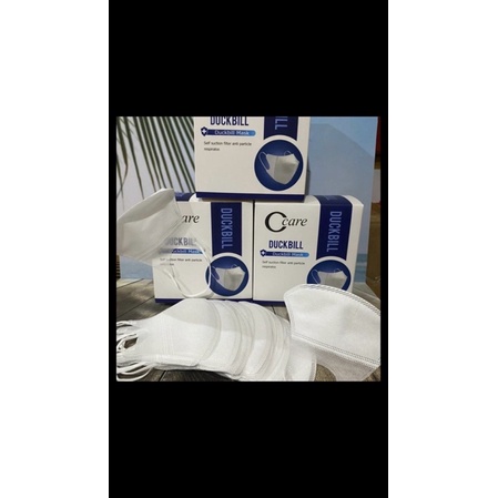 MASKER DUCKBILL PUTIH GARIS EMBOS MERK C CARE ADA EMBOS MERK C CARE 1 BOX ISI 50 PCS