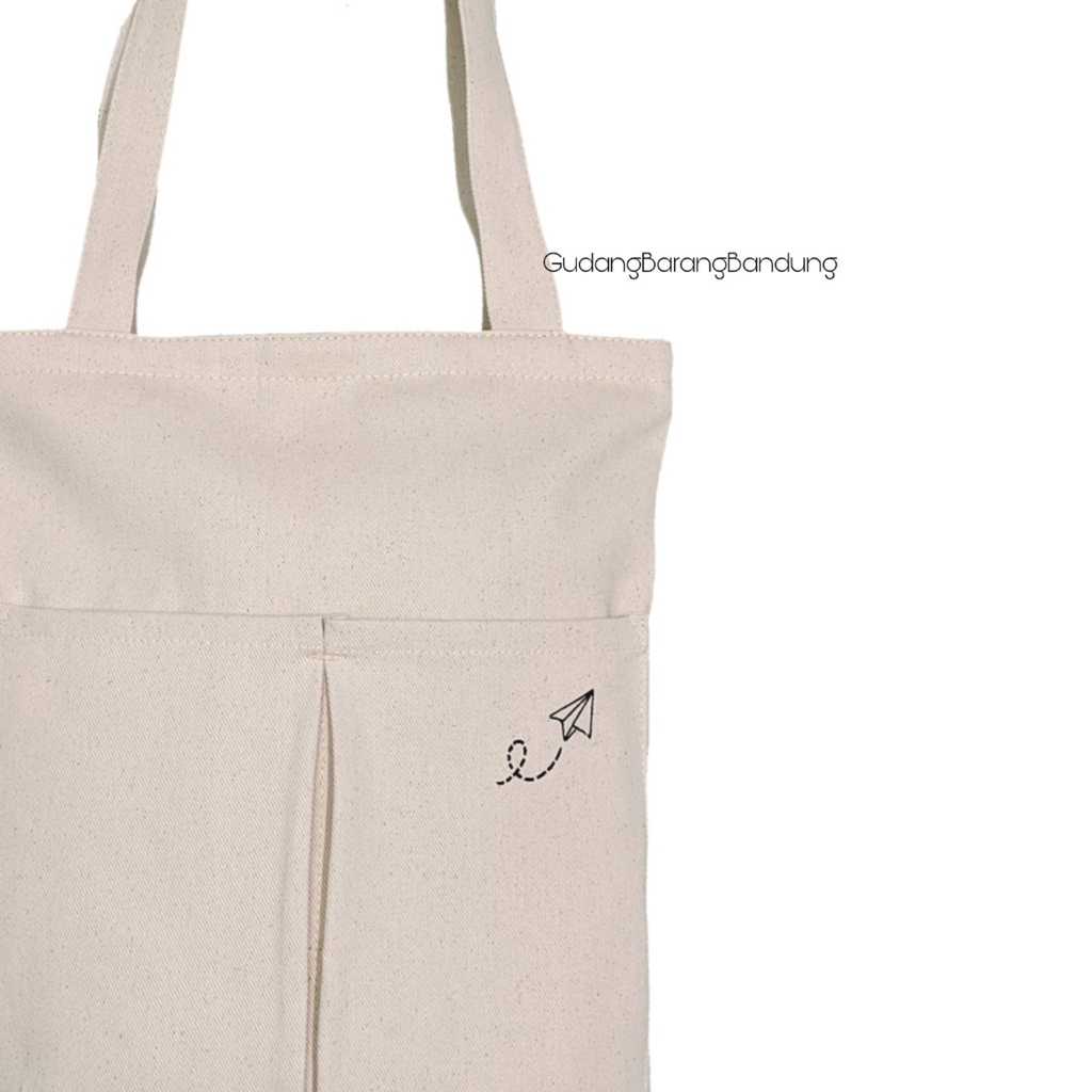 Tote Bag canvas RAHMA PAPER PLANE dengan Resleting dan Double Saku Tambahan Di Depan: Gaya yang Simpel dan Bergay