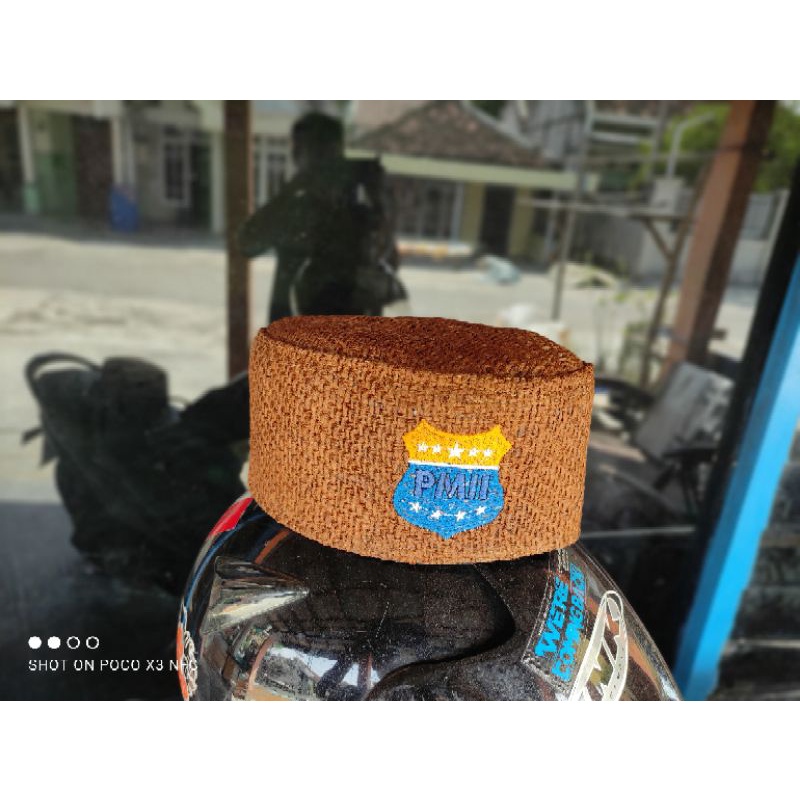 peci goni logo PMII coklat tua