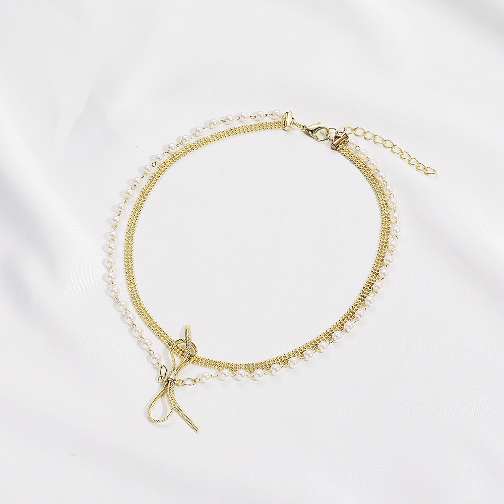 Kalung Mutiara Busur Ganda Fashion Niche Susun Wanita Rantai Klavikula Pendek