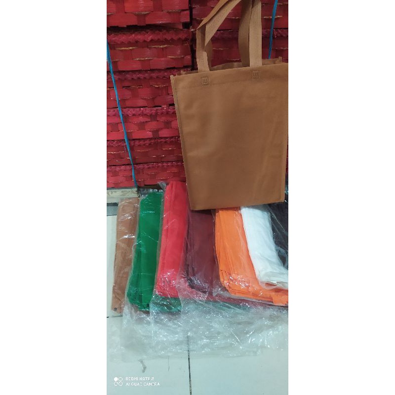 

Tas kain spunbond Goodie bag tas handel isi 12pcs/terlaris dan murah(25*35) jahit