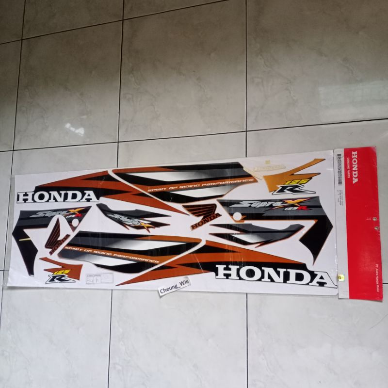 871X0KTMN20ZA lis body stiker striping Honda Supra x 125 R 2006 -2007 Coklat Radiant orange ori AHM