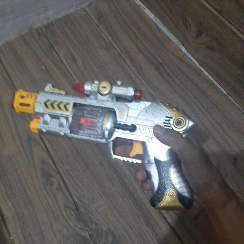 Mainan anak pistol laser bergetar lampu dan suara
