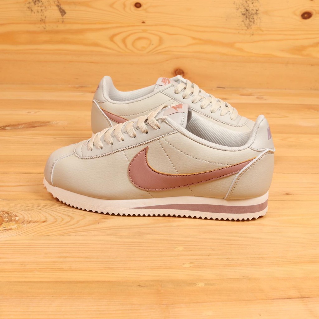 beige leather nike