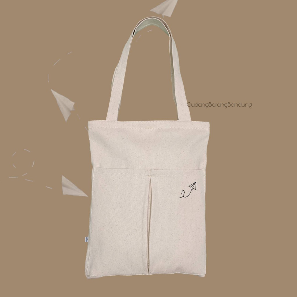 Tote Bag canvas RAHMA PAPER PLANE dengan Resleting dan Double Saku Tambahan Di Depan: Gaya yang Simpel dan Bergay