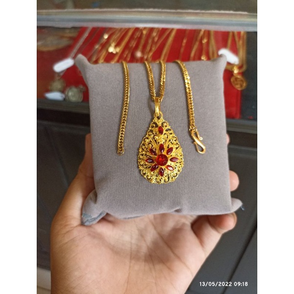 kalung titanium liontin ukiran bali bahan alpaka lapis emas