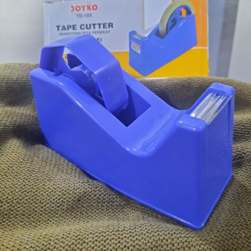 

Tape Cutter | Joyko TD 103 | Dispenser Pemotong Selotip |Pemotong Solasi | Pemotong Pita Perekat