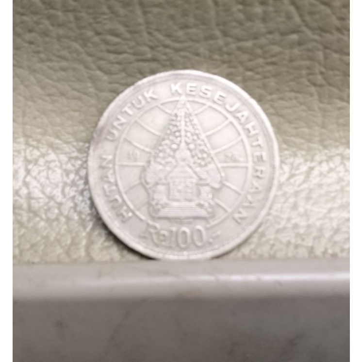 uang logam 100