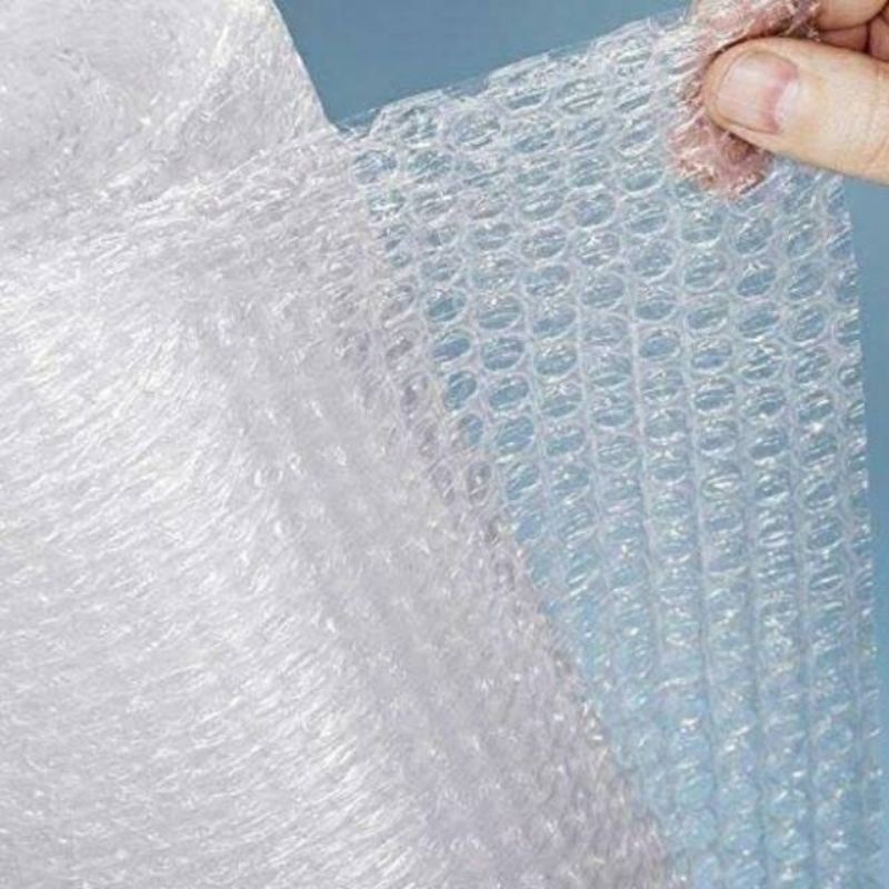 

Packing bubble wrap atau kardus