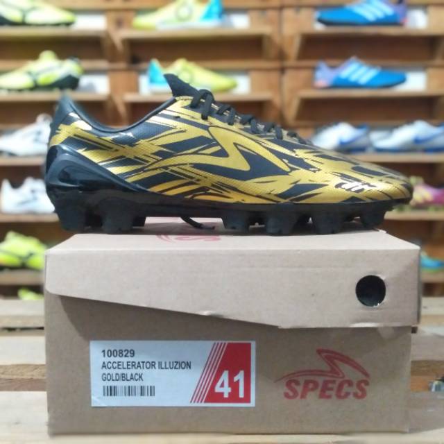 Sepatu bola Specs accelerator illuzion FG ( gold / black )