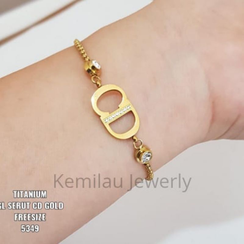 Gelang serut titanium CD gold