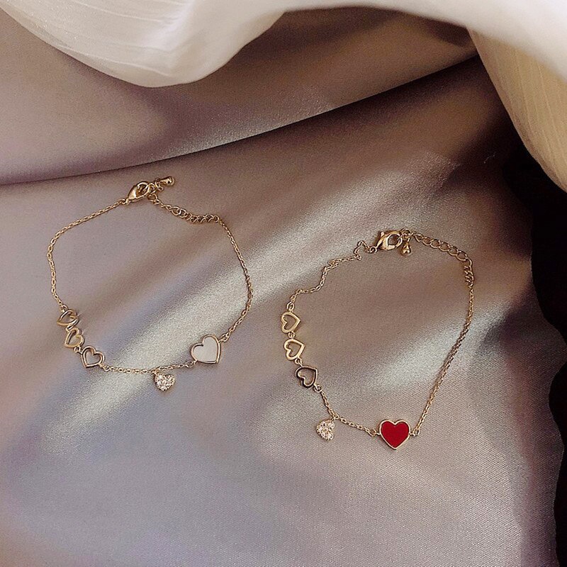 Gelang love bunga lucu fashion wanita warna emas liontin mata permata merah putih bahan rantai serut alloy adjustable ukuran bisa disesuaikan