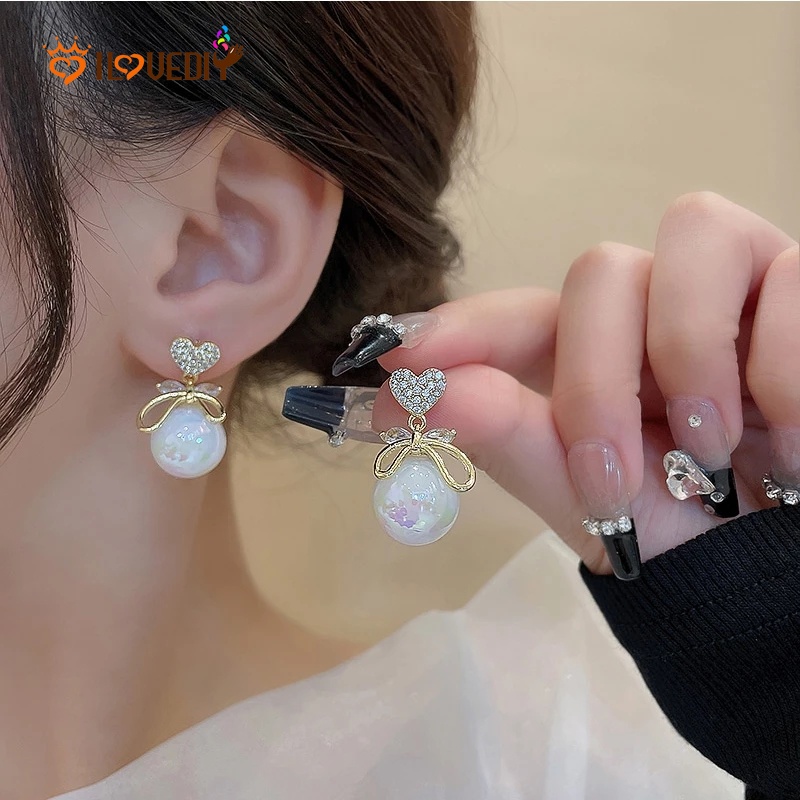 Anting Stud Desain Hati Pita Aksen Kristal Mutiara Berlian Imitasi Gaya Korea Untuk Wanita