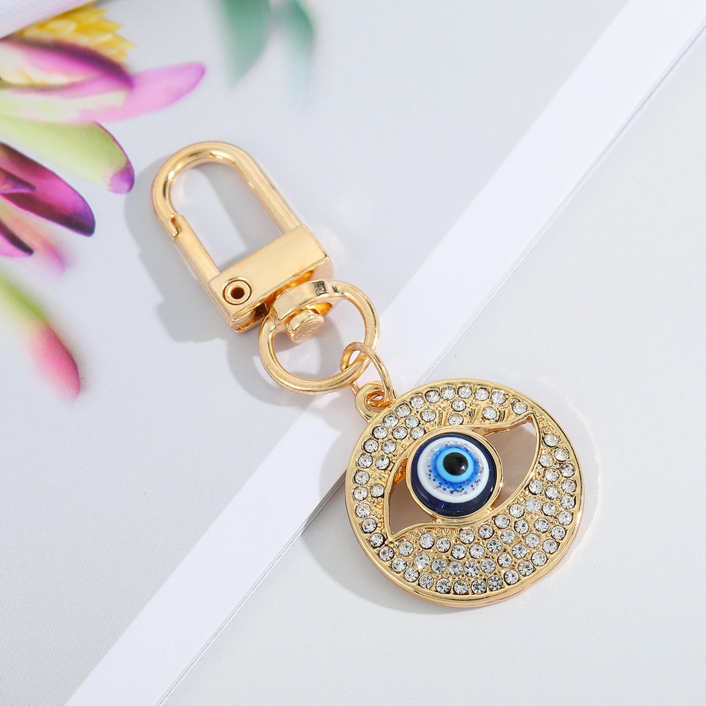 Gantungan Kunci Desain Mata Iblis Bulat Hollow Warna Biru Untuk Pria / Wanita