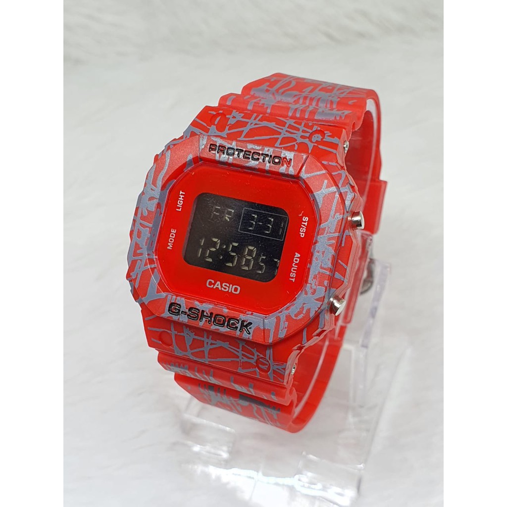 TERLARIS!!!JAM TANGAN PRIA G-SHOCK CASIO DW 5600 GS CASIO SEGI WARNA HITAM ANTI AIR DIGITAL one piece dw bunga dw loreng full hitam best seller ready stock TERIMA COD BAYAR DITEMPAT-TRIBAL MERAH