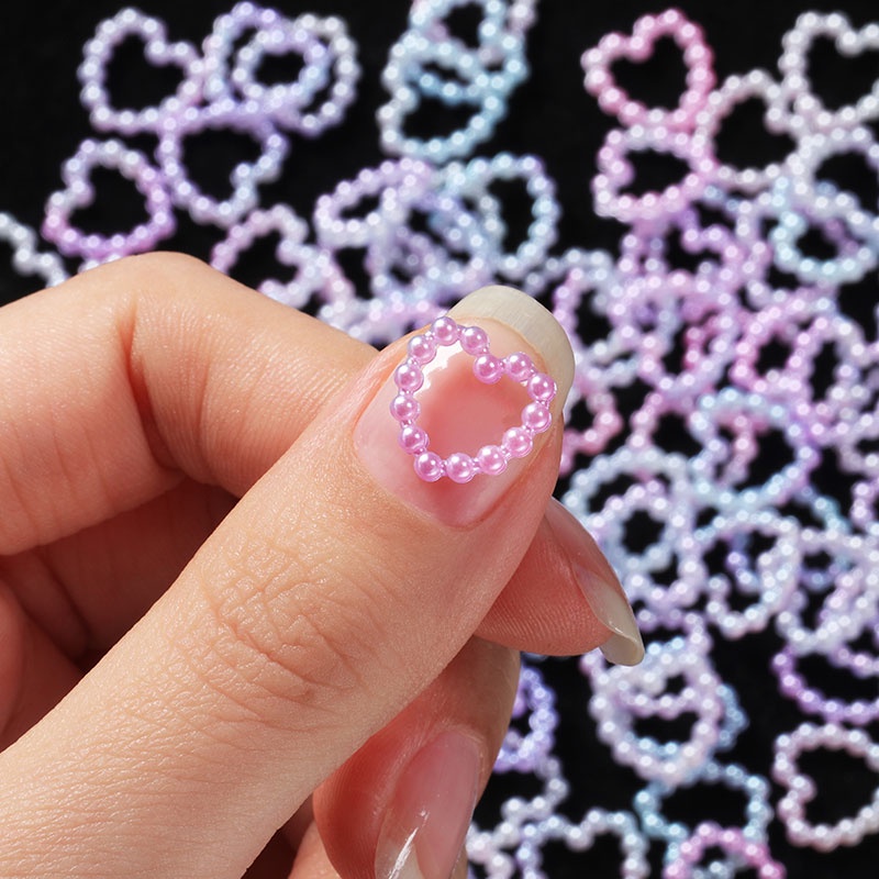 100pcs / Kantong Mutiara Bentuk Hati Hollow Warna Putih Pink Ungu Untuk Dekorasi Kuku