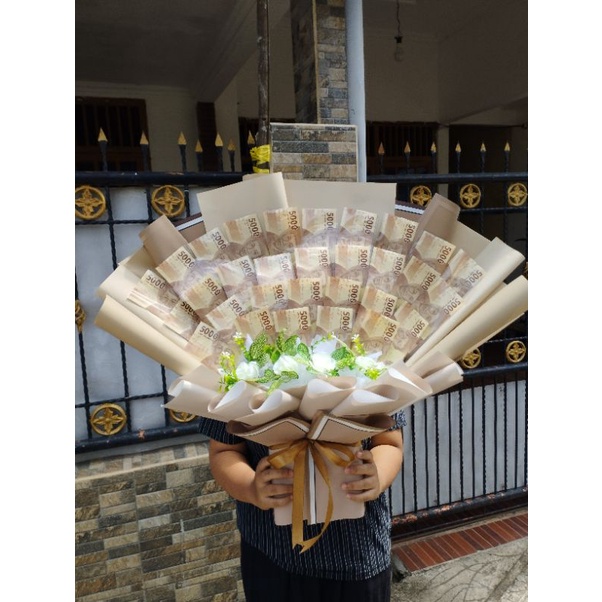 

BUCKET UANG 5000 SEBANYAK 30 LEMBAR