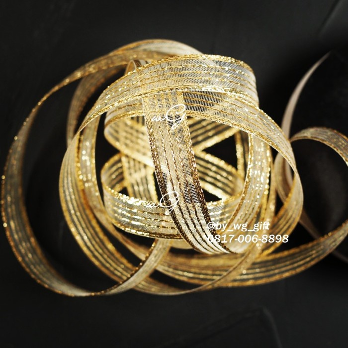 

Pita Gold / emas Garis-Garis Transparan A; Lebar 1.5 cm; Panjang 25 yard