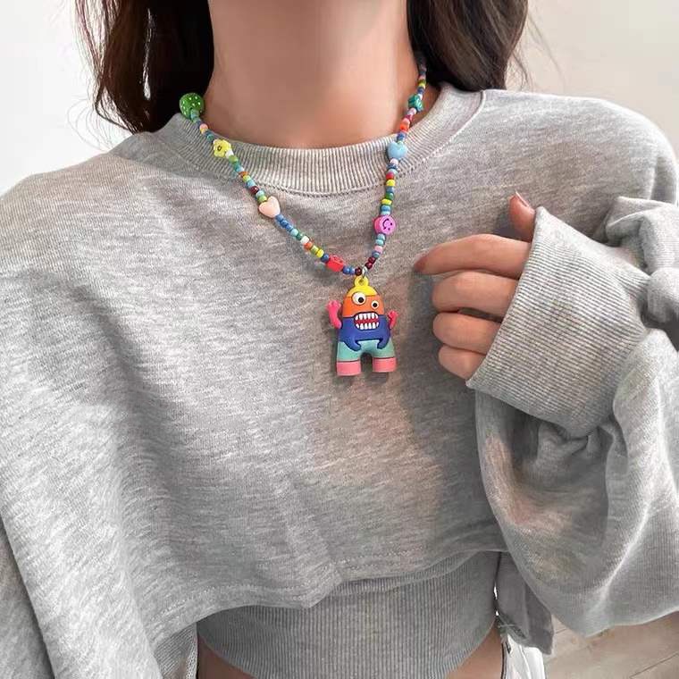 Kalung Rantai Dengan Liontin Kartun Monster Warna Pelangi Untuk Wanita