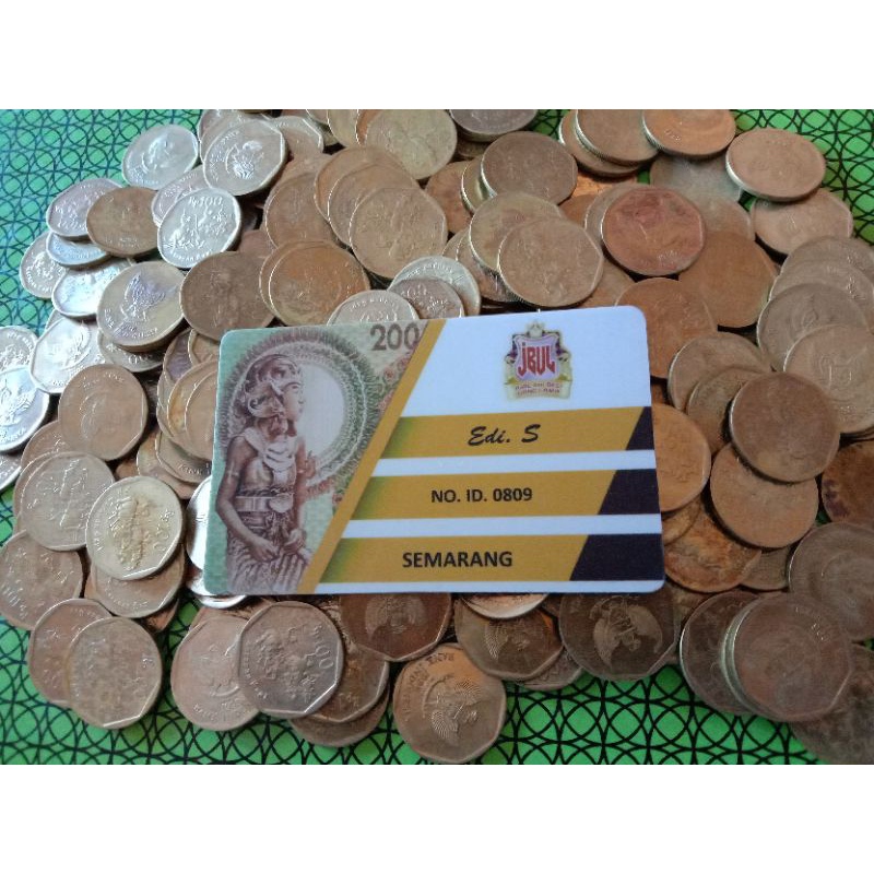 uang 100 rupiah karapan sapi