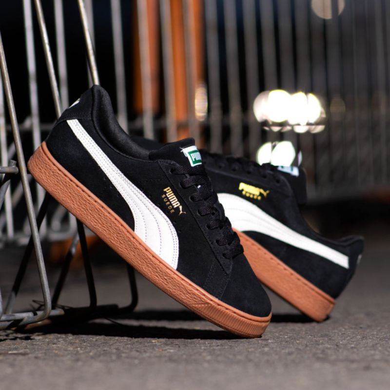 black suede pumas with brown sole