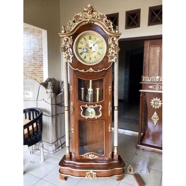 Lemari Jam Hias Anggur Jati Grade A + Bandul Jam + Kaca