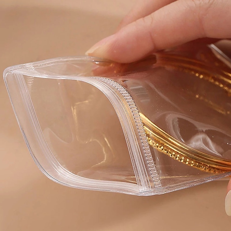 Tas Penyimpanan Perhiasan Cincin / Kalung / Gelang / Anting Portable Bahan PVC Transparan Anti Oksidan / Debu