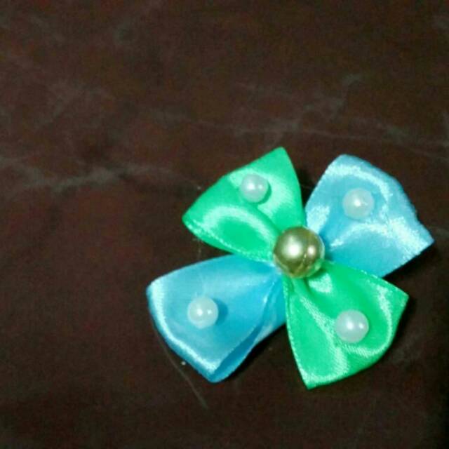 

Souvenir bunga pita manik emas/unik