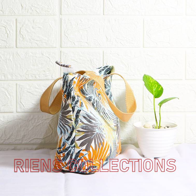 RIENS COLLECTIONS. HANDBAG KECIL BAHAN KANVAS MOTIF FLORAL PALM ORANGE