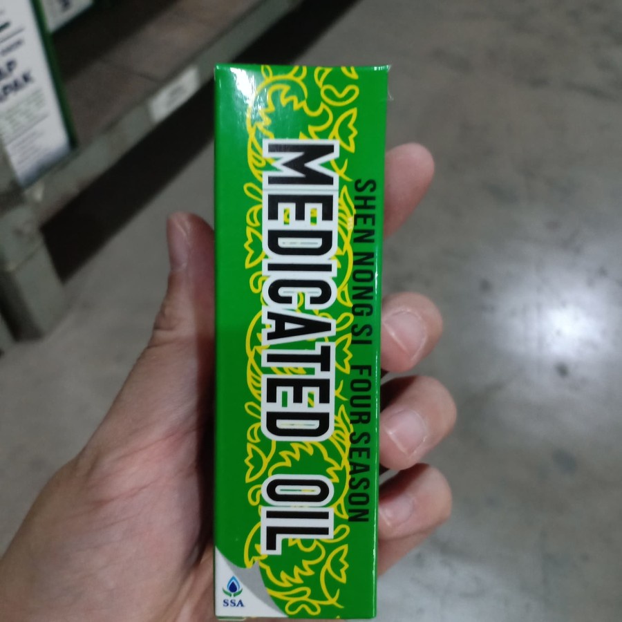 Medicated oil si ji you 40 ml minyak angin cina untuk sakit kepala dan masuk angin