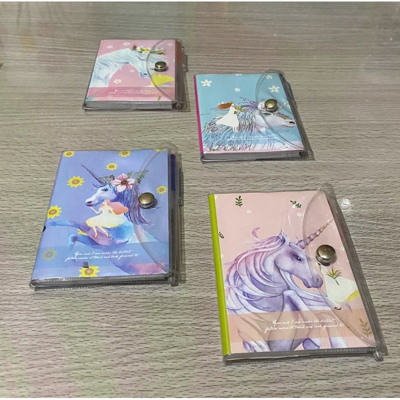 

Notebook notes sampul buku mini unicorn dengan bolpen