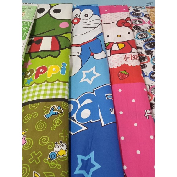 Bahan Kain Sprei Disperse Piyama Motif Karakter Kartun Anak Doraemon Katun Microtex  METERAN