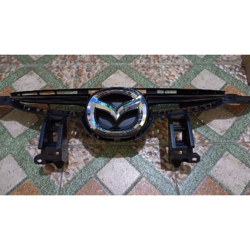 Grill Mazda 2 (GRILL RADIATOR) tahun 2010-2012. ORI (Genuine Part)