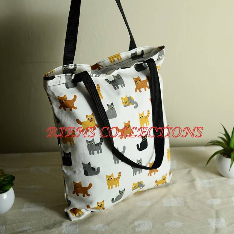 TOTEBAG KANVAS . TAS KANVAS MOTIF KUCING LATAR PUTIH. RIENS COLLECTIONS