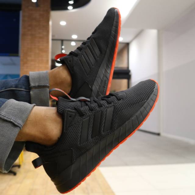 harga adidas questar ride full black