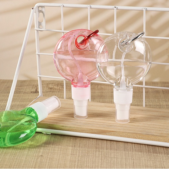 1pc Botol Semprot Bulat Bahan Plastik Warna Acak Dengan Gantungan Kunci Untuk Pelembab Wajah