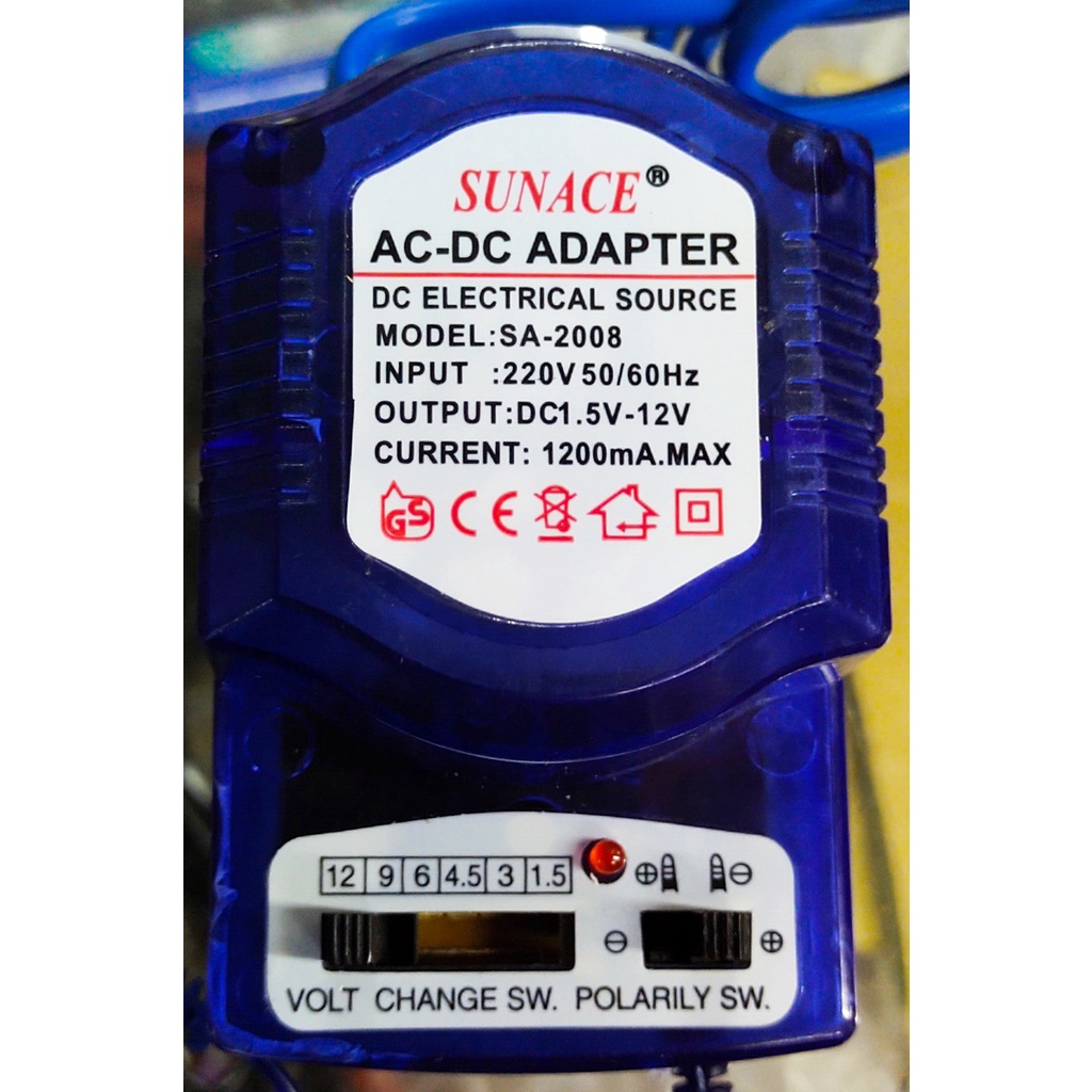 Adaptor Multifungsi/universal Volt 1,5V/ 3V/4.5V/6V/9V/12v(1200ma)Transparan