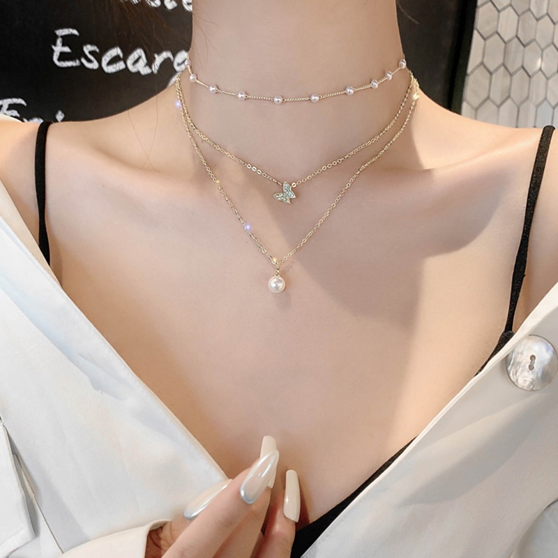 Kalung Multilayer Liontin Kupu-Kupu Aksen Mutiara Bahan Metal Warna Emas Untuk Wanita