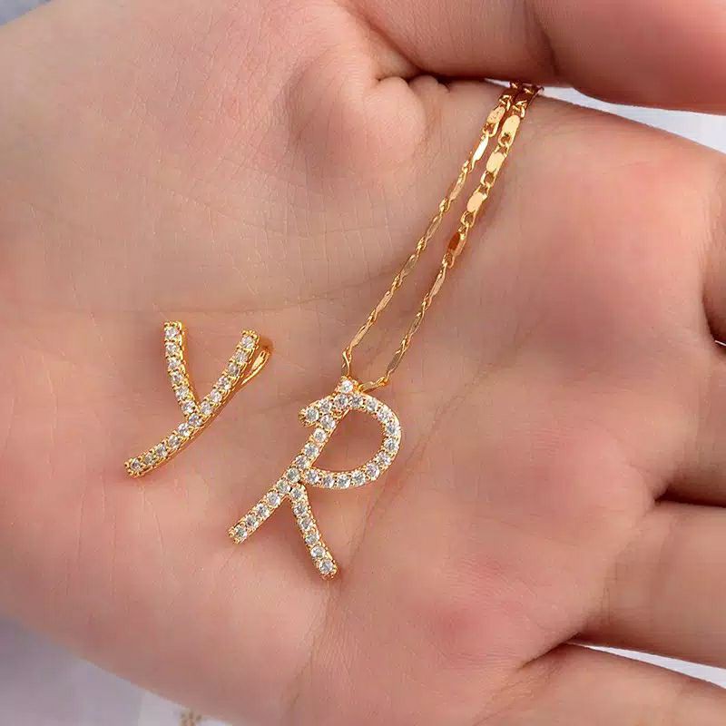 kalung titanium nagita huruf