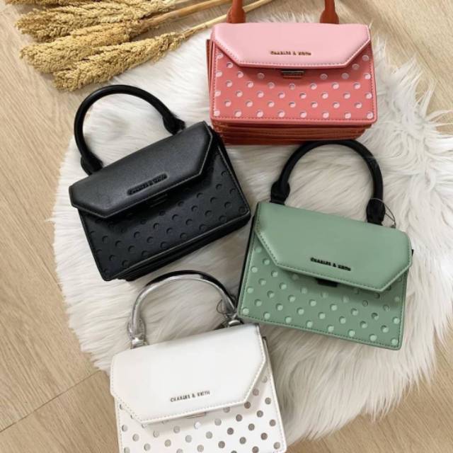 CK LASER CUT SLING BAG