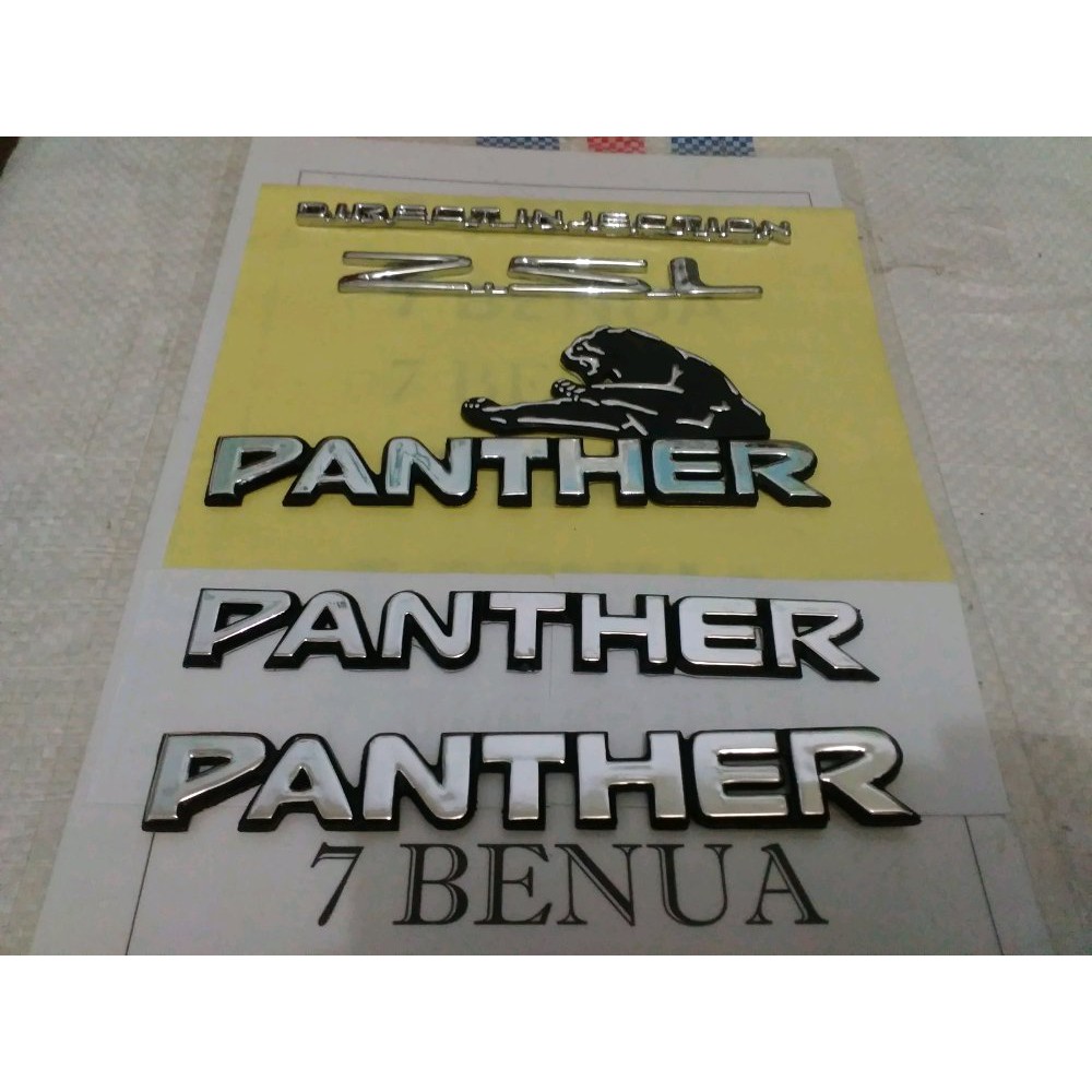 LOGO ATAU EMBLEM BELAKANG DAN NE H-42 SAMPING ISUZU PANTHER KOTAK ATAU ROYAL OR HI GRADE TAHUN 1999
