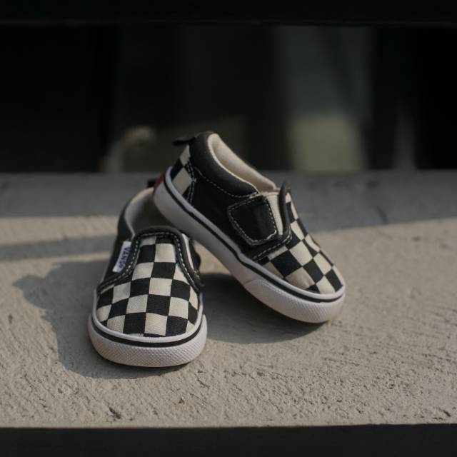 Preloved Vans checker board slip on