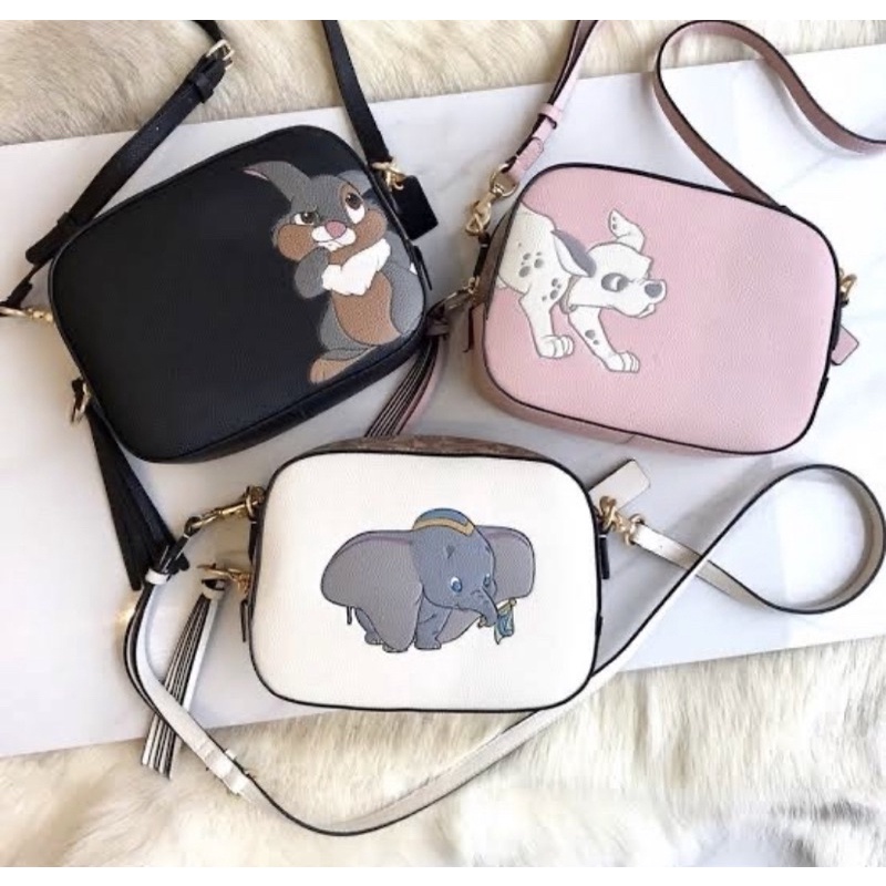 DISNEY X COACH CORNER CAMERA SLING BAG WITH DUMBO (COACH 69252)